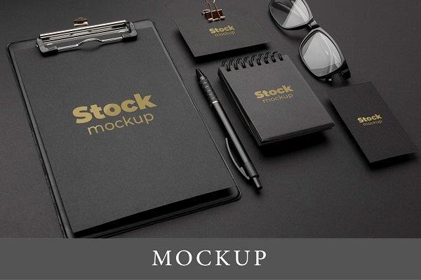 designed stationery on a black table